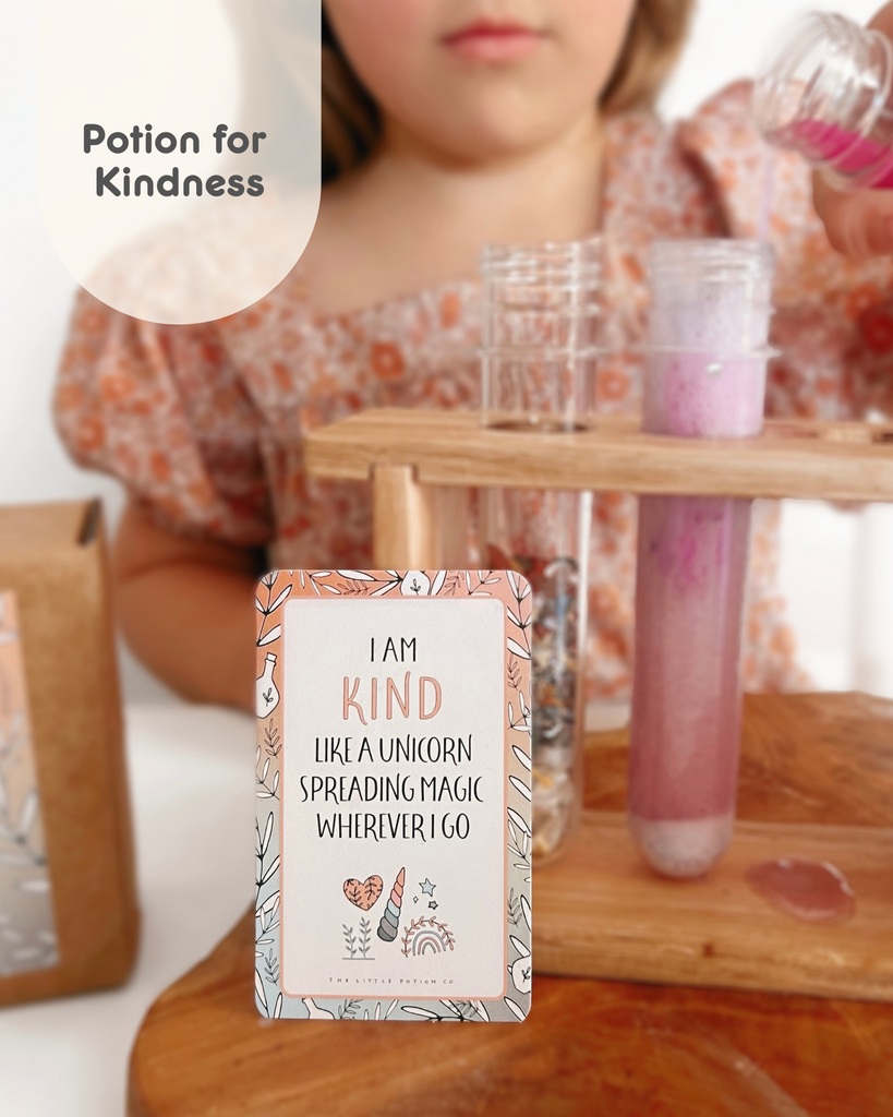 Rainbow Sparkles Mini potion kit. A potion kit for Kindness. Image shows an affirmations stating I am Kind like a Unicorn spreading magic wherever you I go and a test tube with a pink potion liquid. 