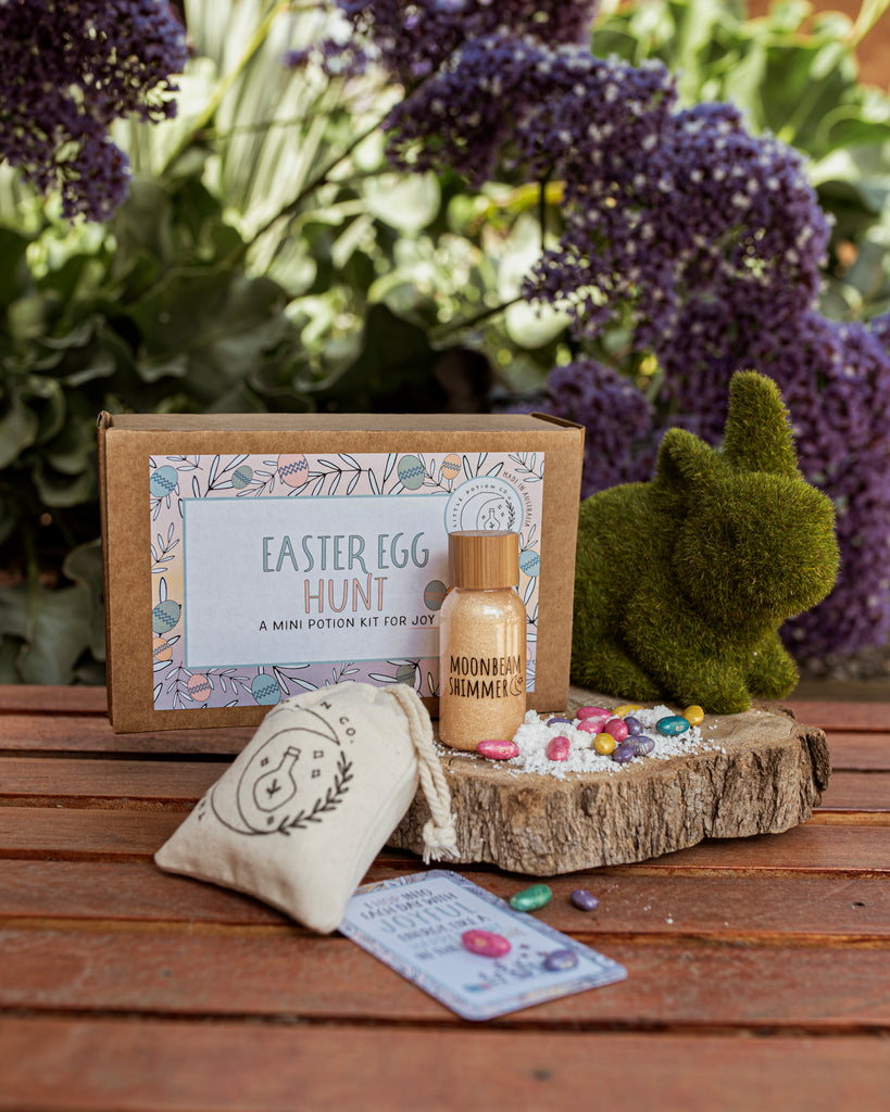 Easter egg potion kit for joy on a wooden board with a grass bunny